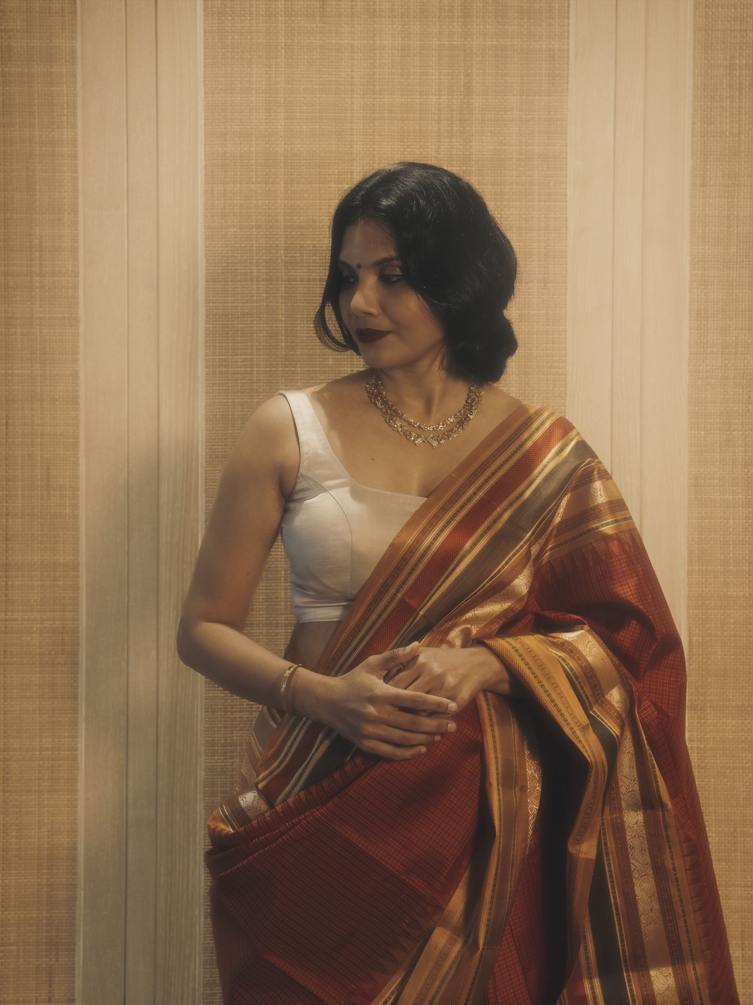 Rust and gold Kanjivaram saree by Kandasami