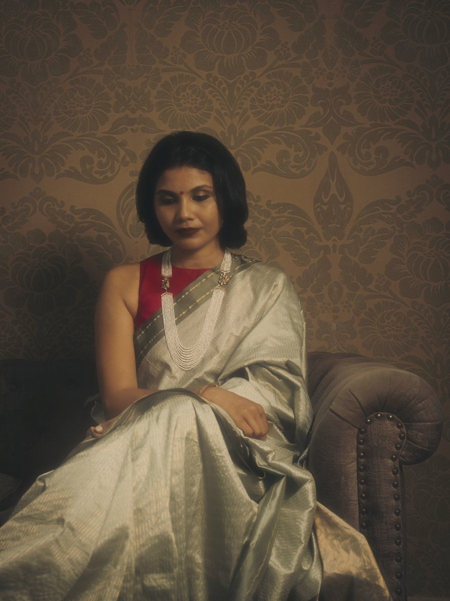 Silver-grey tissue silk saree with pearl cascade